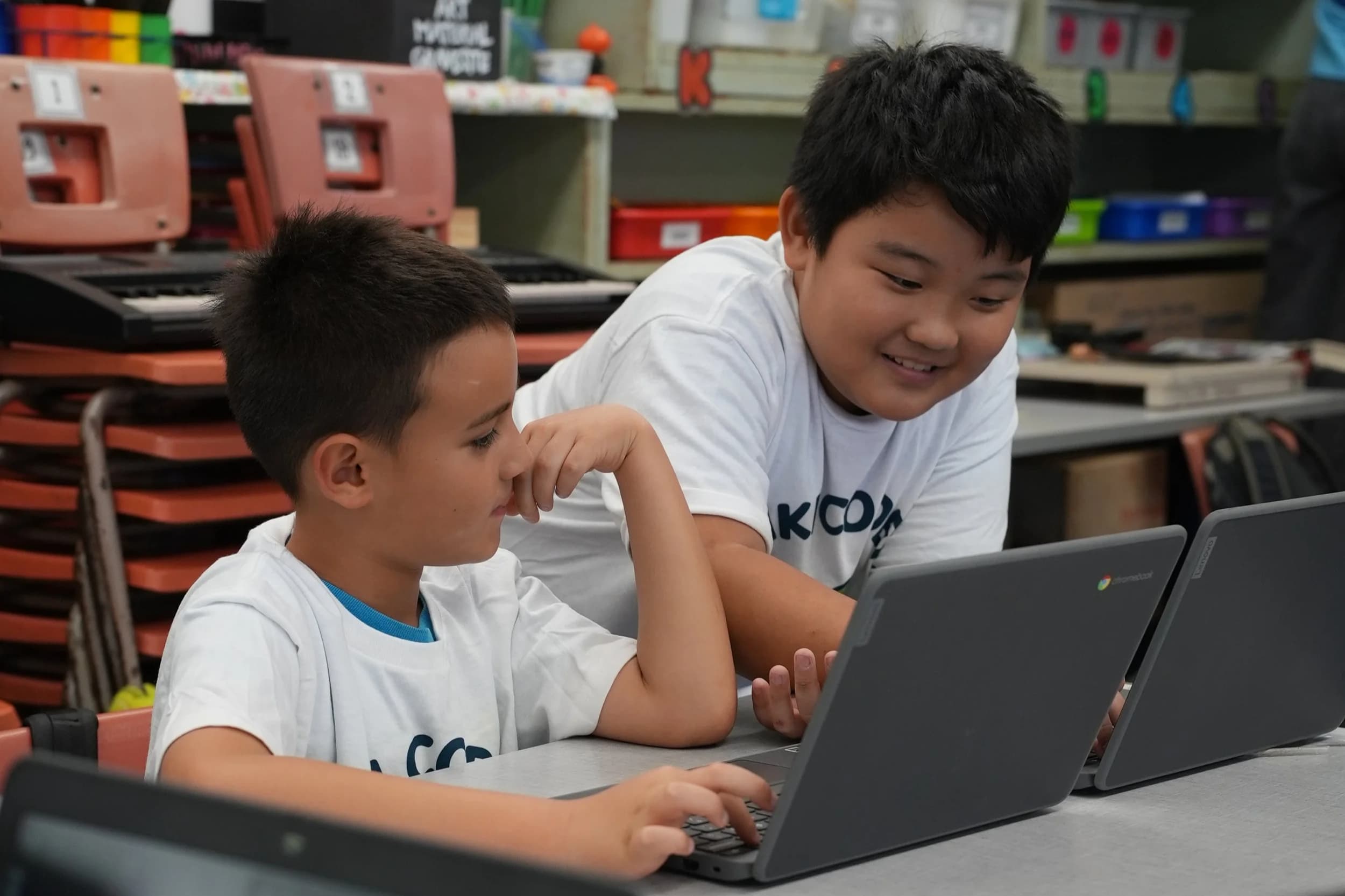 Kids coding on laptops in class in O'ahu